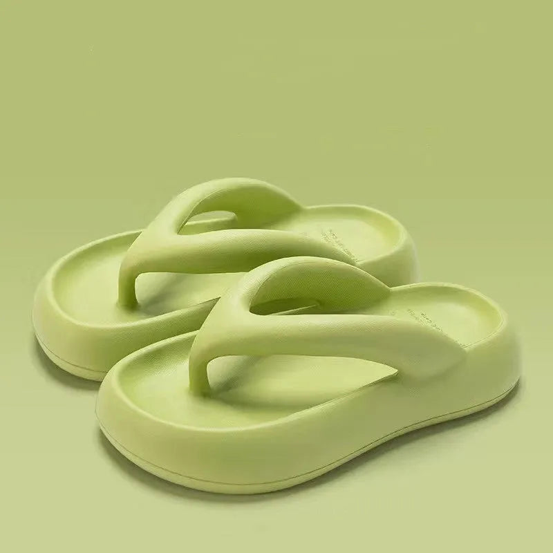 Women's solid colour EVA flip-flops with a thick sole and a bow detail on the upper.