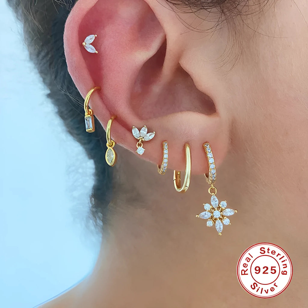 Sterling silver snowflake pendant earrings with diamond accents in white gold or yellow gold colour finish.