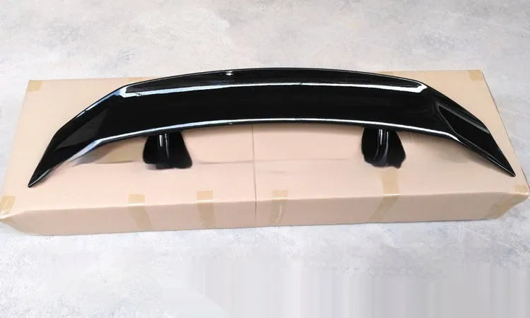 Universal punch-free ABS plastic car spoiler tail wing in bright black finish.