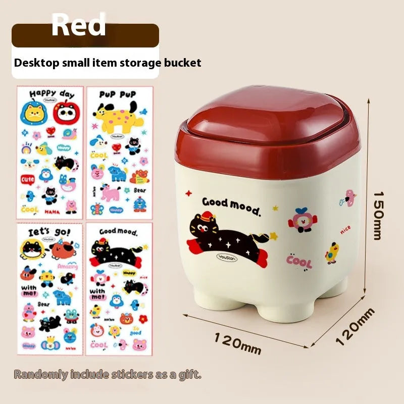 Red and brown cartoon sticker designs on a plastic desktop storage box with grid organiser compartments.
