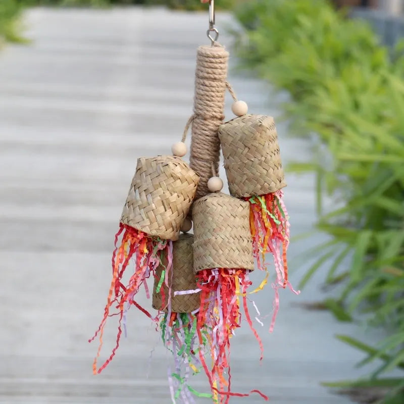 Colourful shredded paper parrot toy with wood and sisal construction measuring 35cm long