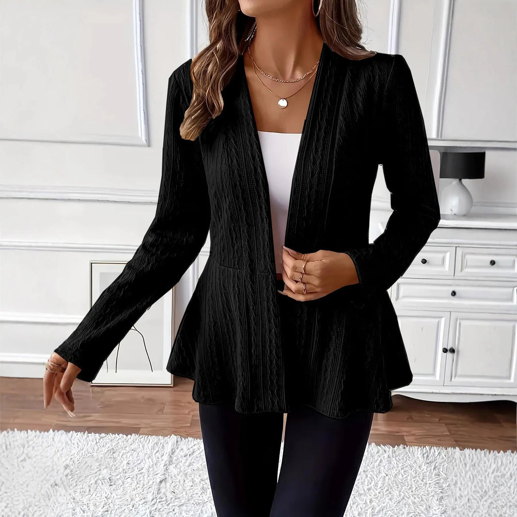 Women's apricot coloured Jacquard patterned knitted cardigan with one button, shown on a model.