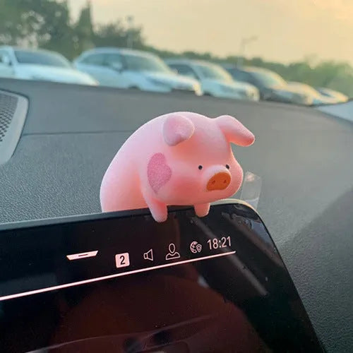 Cartoon pig character resin car ornament for dashboard or windscreen decoration.