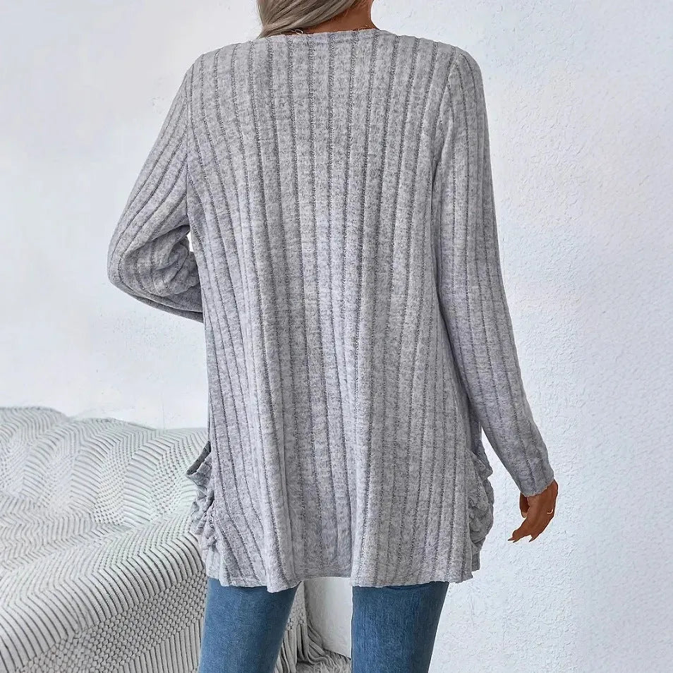 Solid colour long sleeve cardigan with front pockets in loose oversized fit