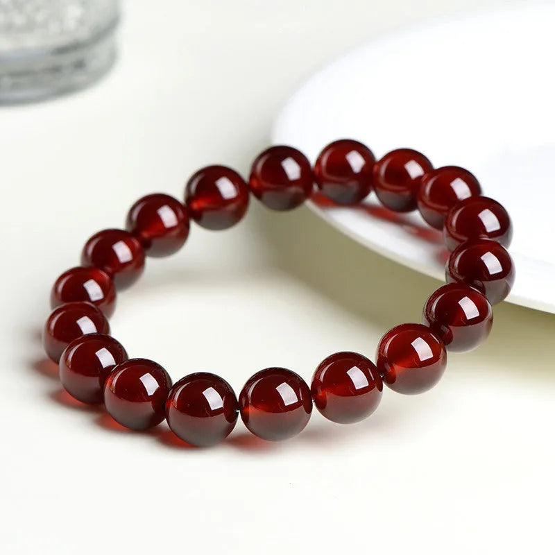 Natural orange red garnet ball crystal bracelet with Ruyi design element in unisex retro style
