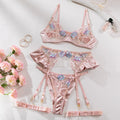 Light purple satin four-piece lingerie set with embroidery detail on a hanger.