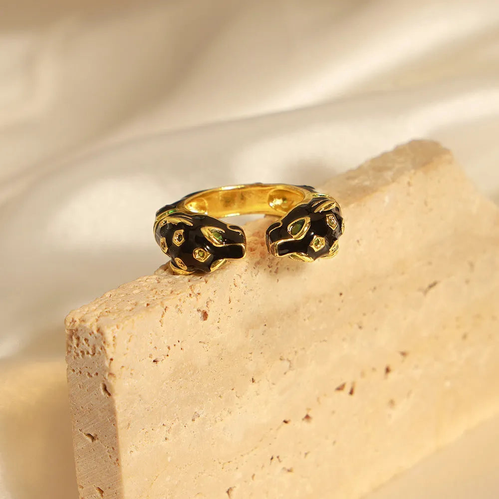 Women's black cheetah print open ring with geometric design and electroplated copper construction