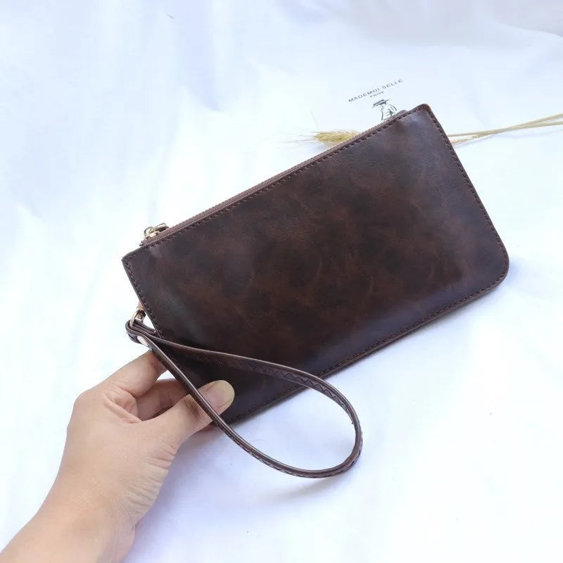 Mini touch screen phone bag in cross square shape with soft surface material, blue colour, and zippered pockets