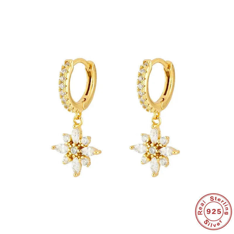 Sterling silver snowflake pendant earrings with diamond accents in white gold or yellow gold colour finish.