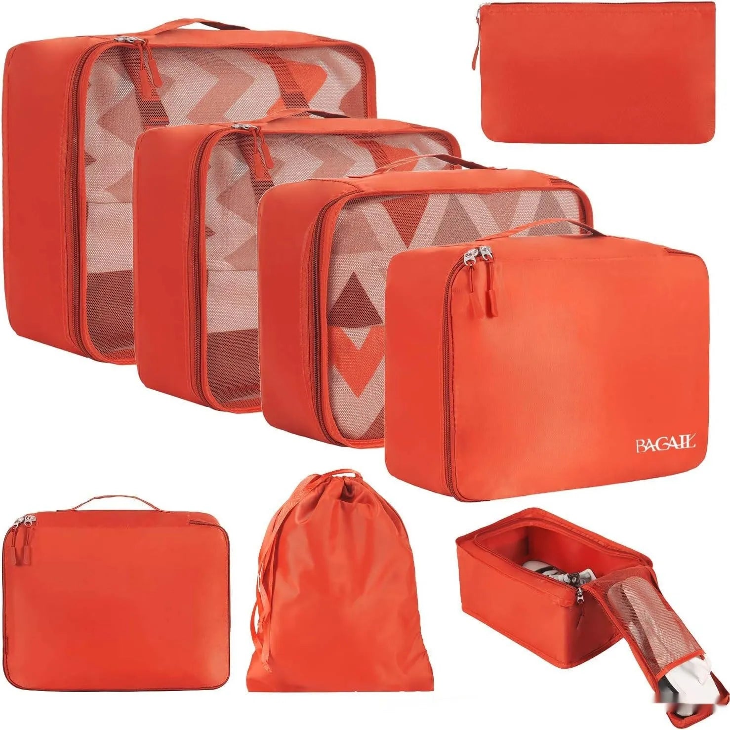 Set of eight cubic-shaped travel packing bags in assorted colours including beige, black, pink, and leopard print patterns.