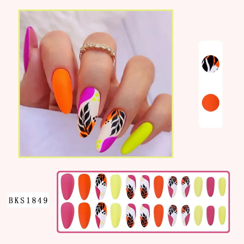 Wear Armour medium almond frosted nail stickers showing four designs: colourful leaves, leopard print, macarons, and plating.