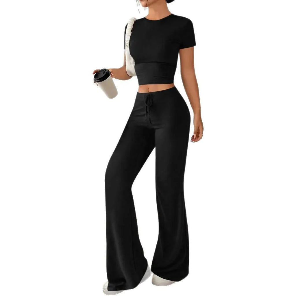 Black polyester women's high waist trousers and short sleeve t-shirt suit on hanger