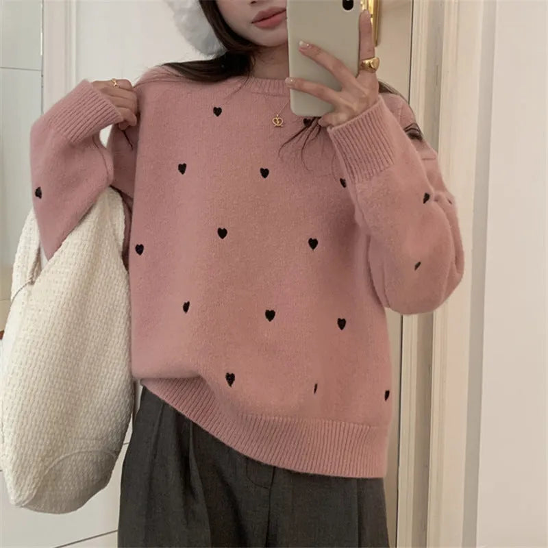 Women's loose fit grey acrylic pullover sweater with embroidery on the front.
