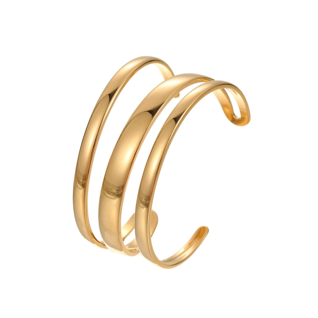 Stainless steel women's bracelet with geometric line design, shown in gold and steel finish options
