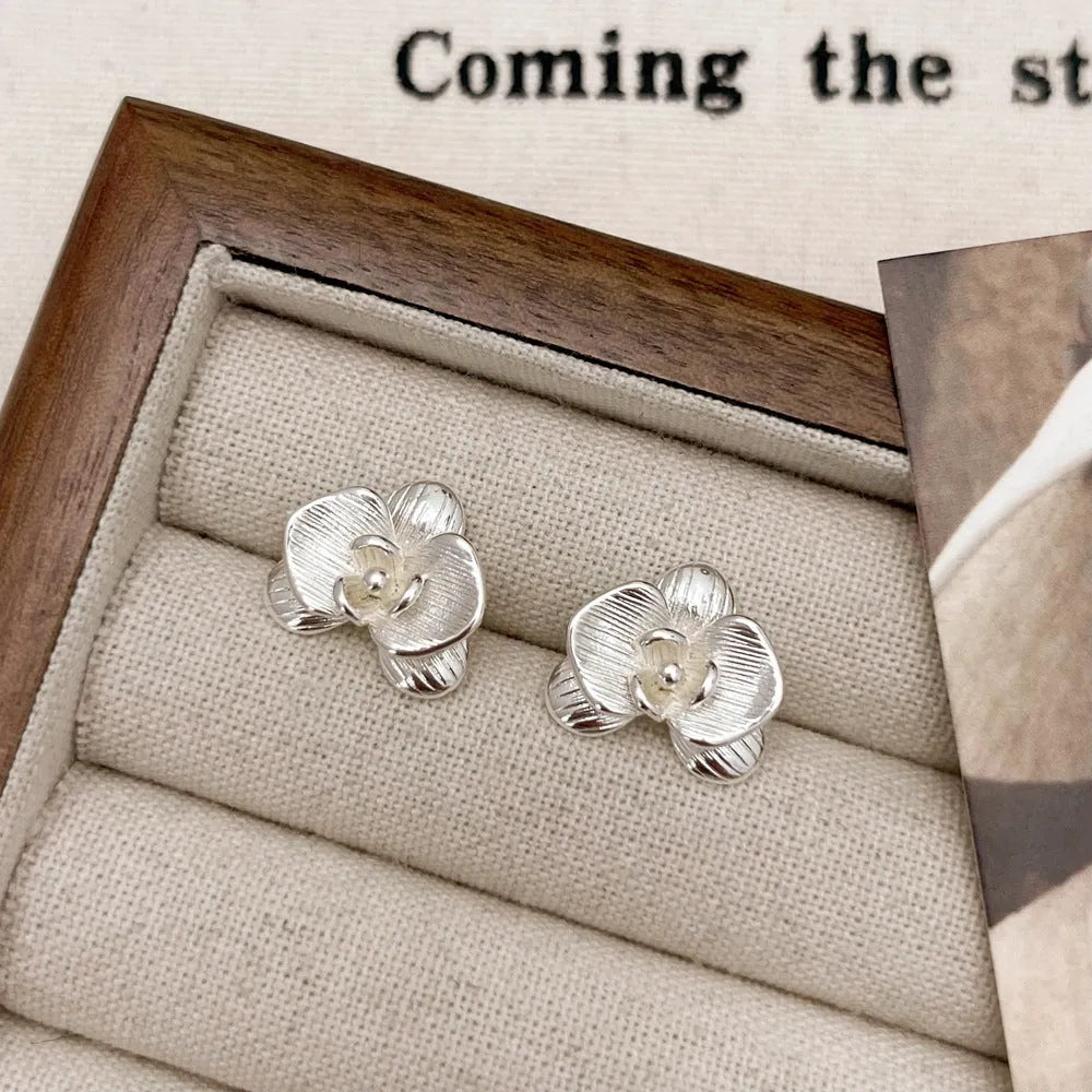 Retro flower fashion earrings for women with petal design in gold or silver electroplated finish