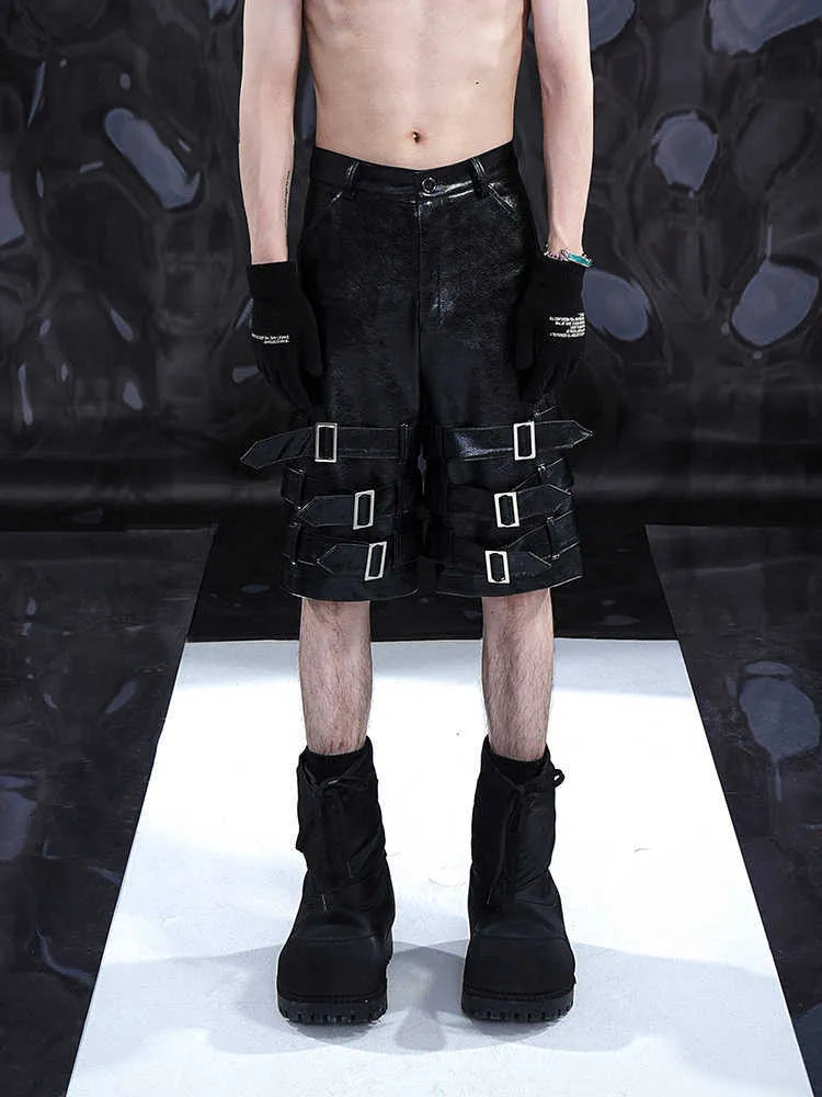 Men's black PU leather casual shorts with cropped length and mid-low waist.