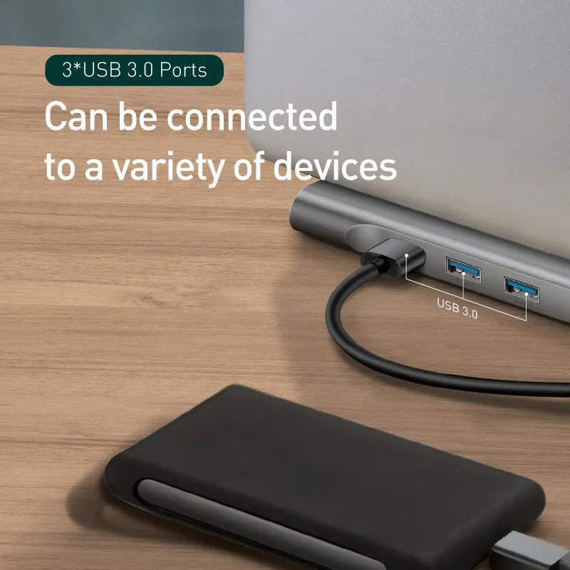 Grey ten-port hub docking station with cooling bracket showing HDMI, VGA, and USB ports