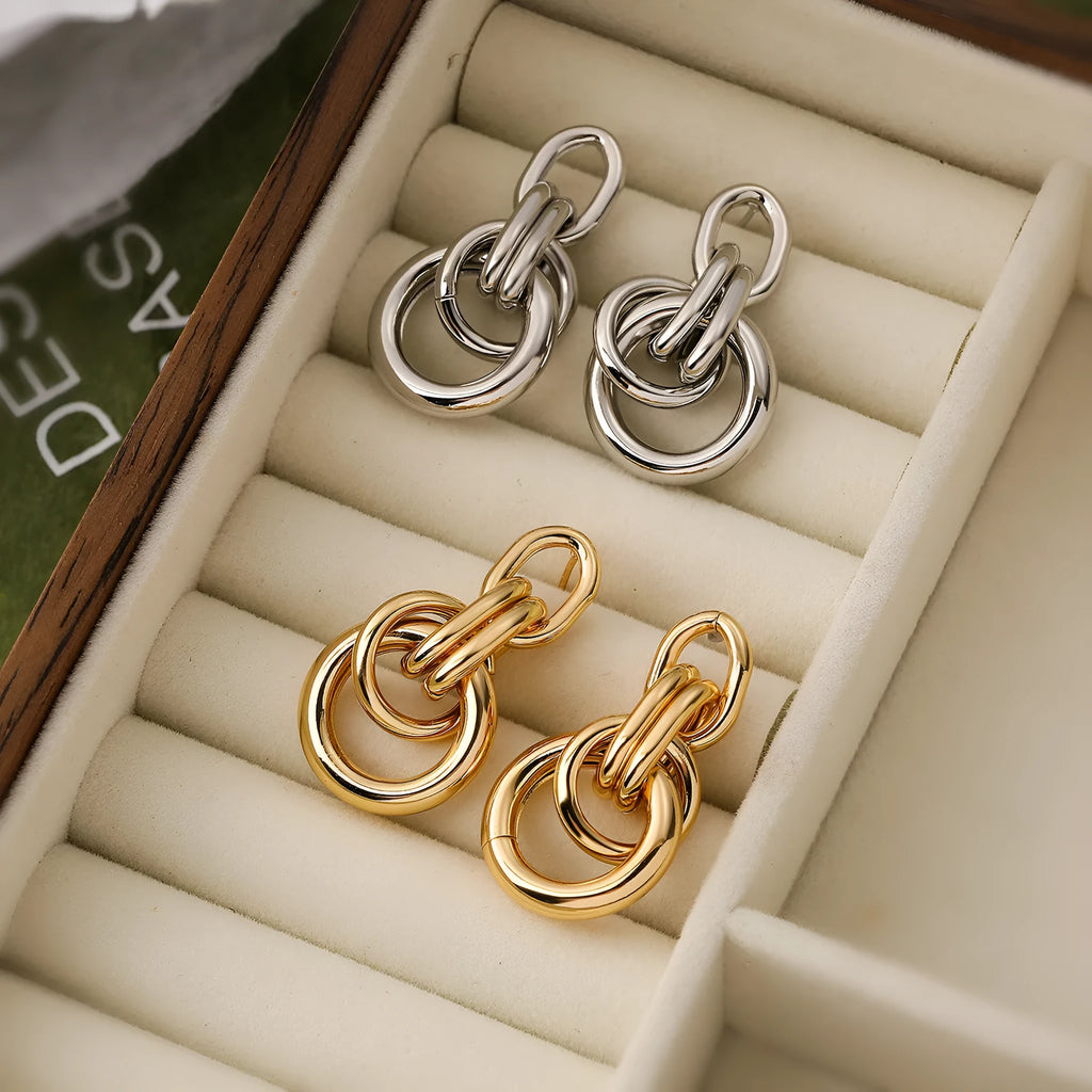 Gold geometric earrings with irregular asymmetric design and INS high-profile styling