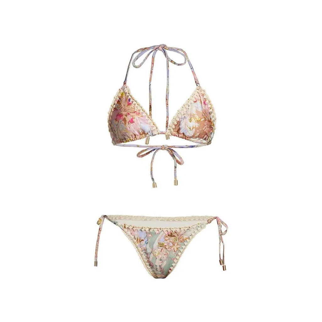 Creamy-white women's floral print bikini set with matching skirt on a hanger.