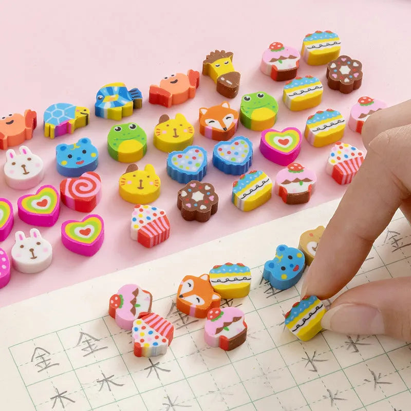 Assortment of fifty small cartoon-shaped rubber erasers in fruit and animal designs.