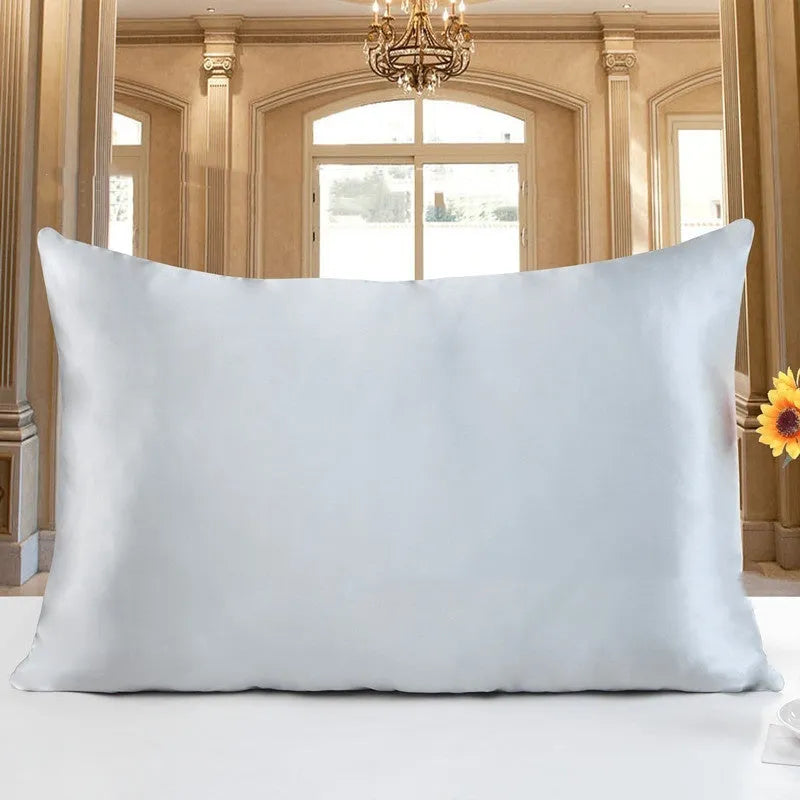 Double-sided 19 M silk pillowcase in apricot colour, showing smooth satin weave texture.