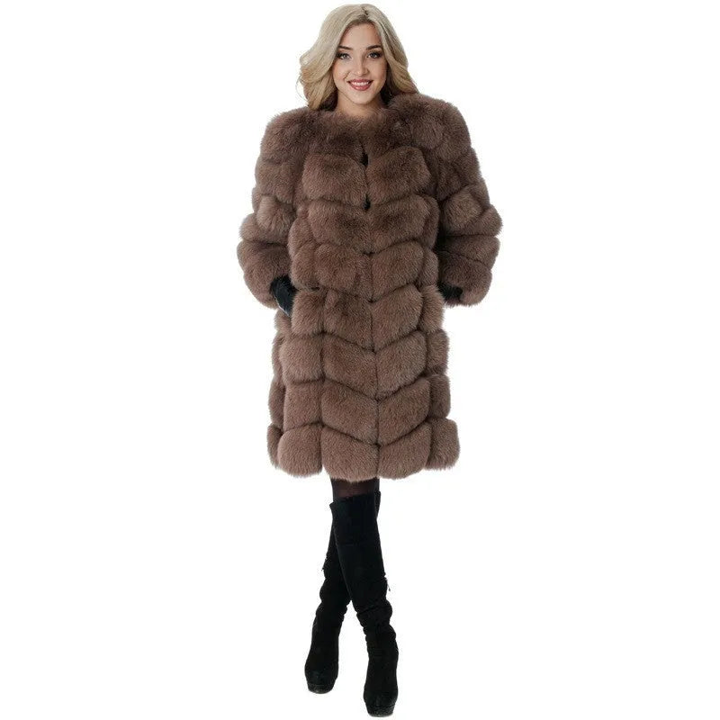 Women's long artificial fur coat in black colour showing regular sleeves and full-length design