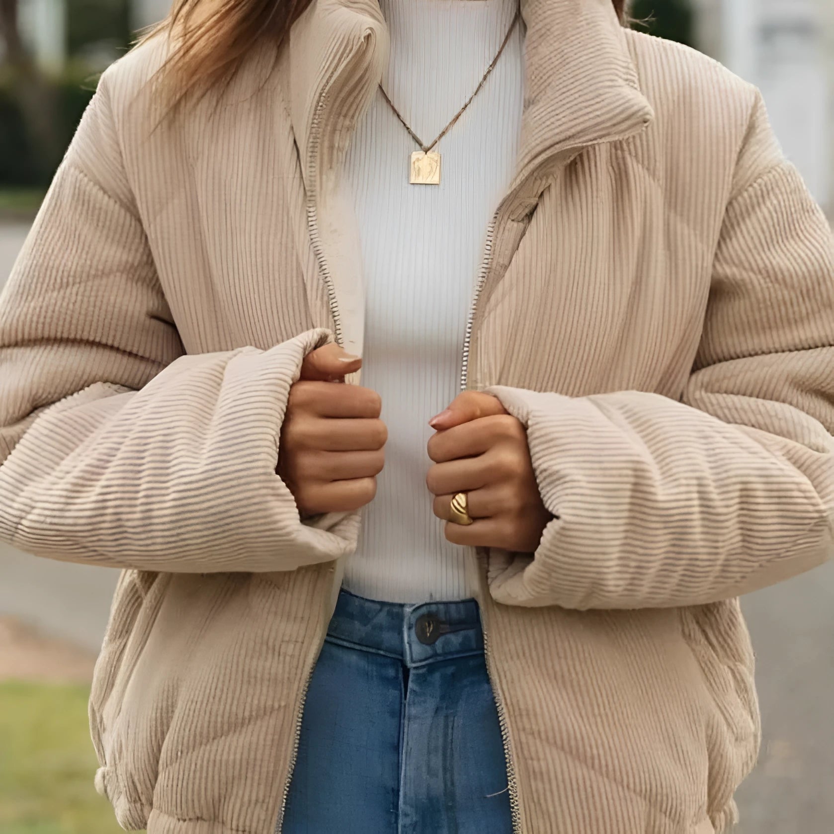 Women's apricot-coloured corduroy jacket with a stand collar and front zipper, laid flat.