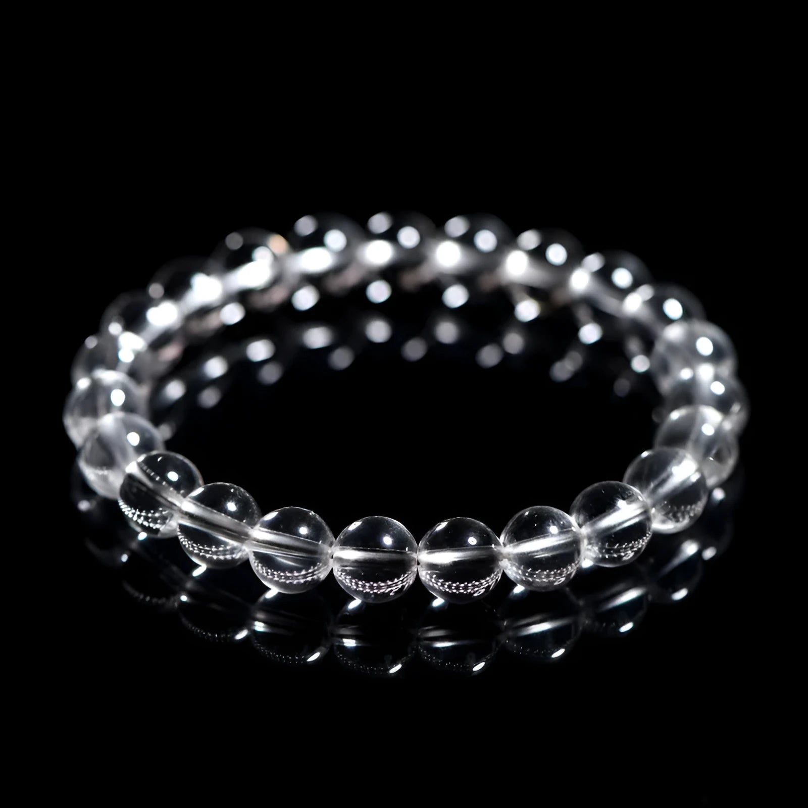 Natural Donghai old materials white water round crystal bracelet with geometric design on wrist.
