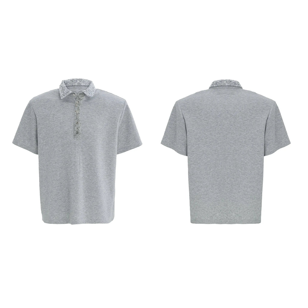 Men's black loose fit polo shirt with a square collar decorated with white embroidery and sequins.