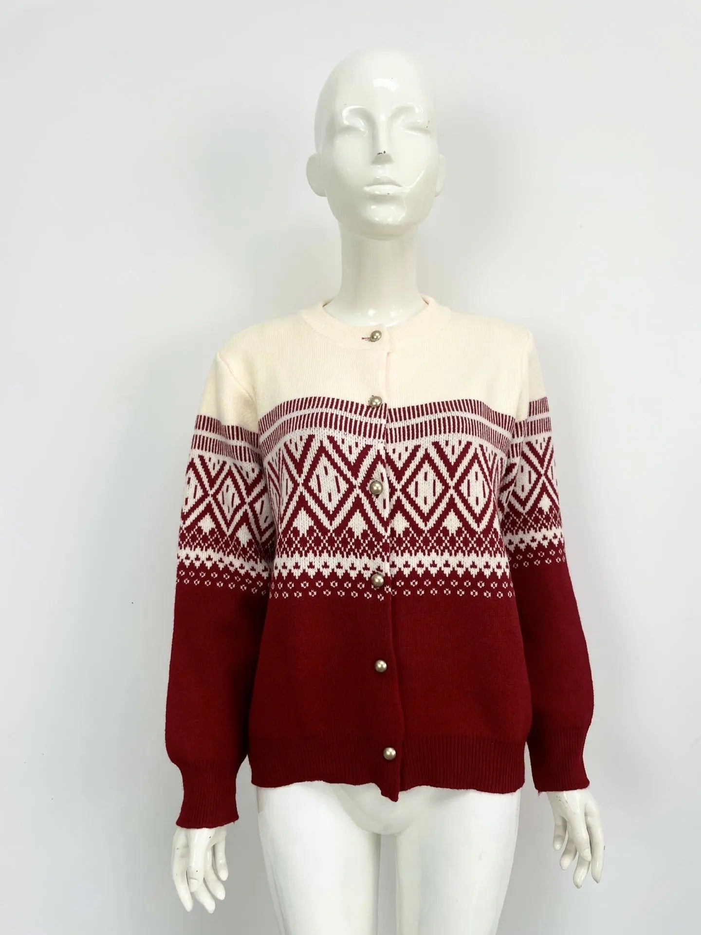 Women's long-sleeved grey alpaca wool cardigan with contrasting diamond knit pattern.
