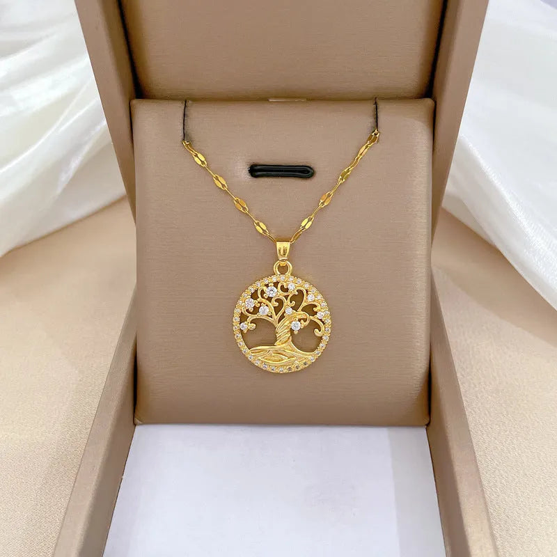 Gold-plated cross necklace with mother pearl inlay and rhinestone detailing on adjustable chain