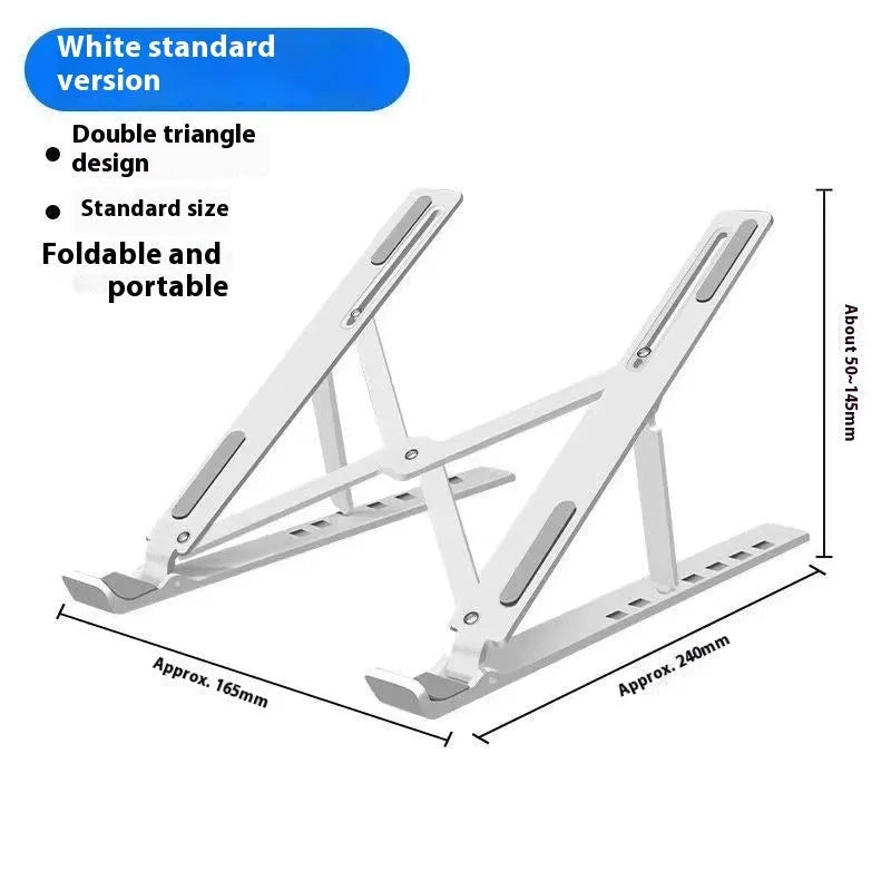 Silver aluminium alloy folding laptop stand with black silicone pads on a wooden desk.