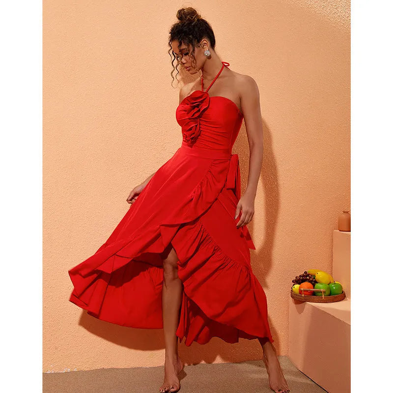 Red women's V-neck one-piece swimsuit with open back and detachable flower, shown with matching skirt.