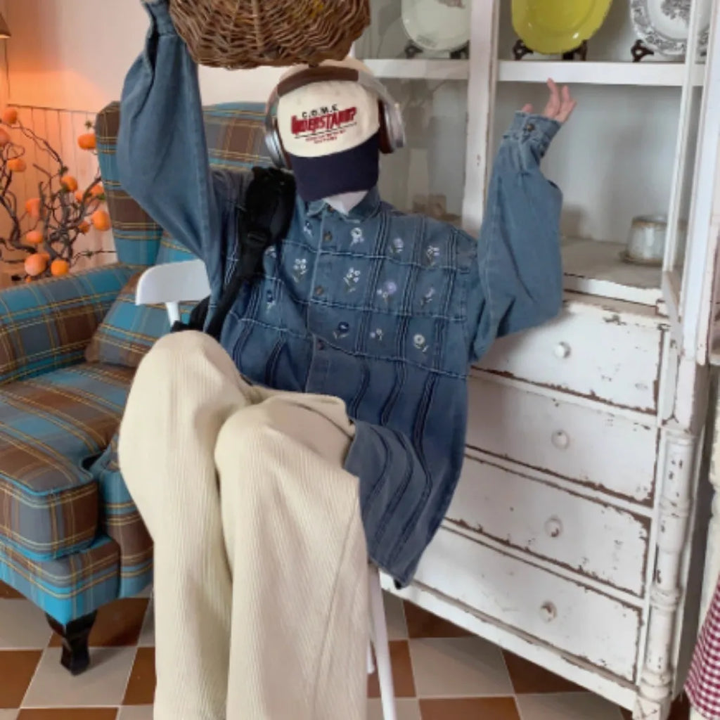 Vintage washed blue denim shirt with small floral print and pleated detail, long sleeves with button front