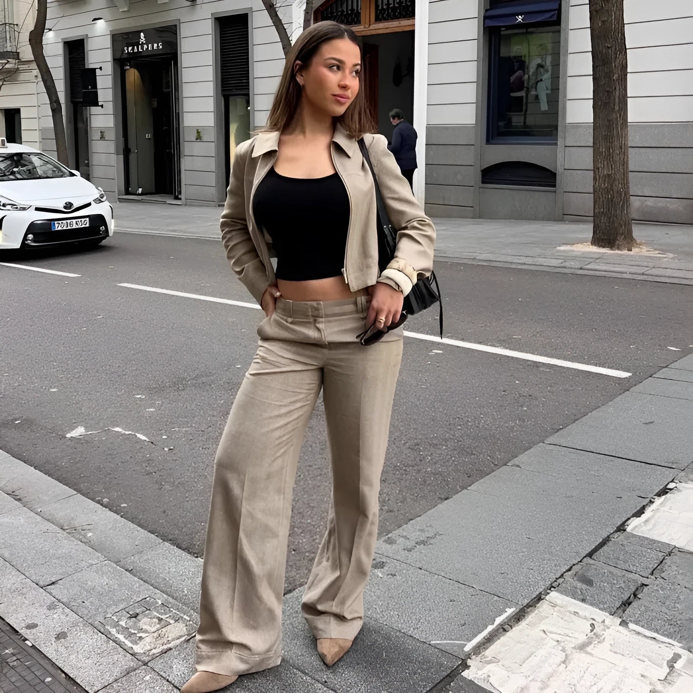 Women's beige herringbone pattern jacket and trousers suit set with 3D embroidery detail.