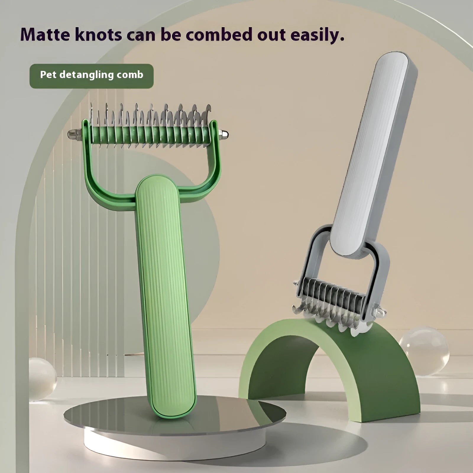 Green and grey dog grooming comb for untying knots, showing small and large size options.