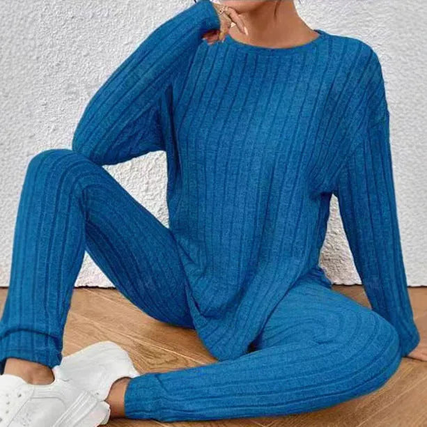 Women's black sunken stripe two-piece homewear set with a regular sleeve top and trousers.