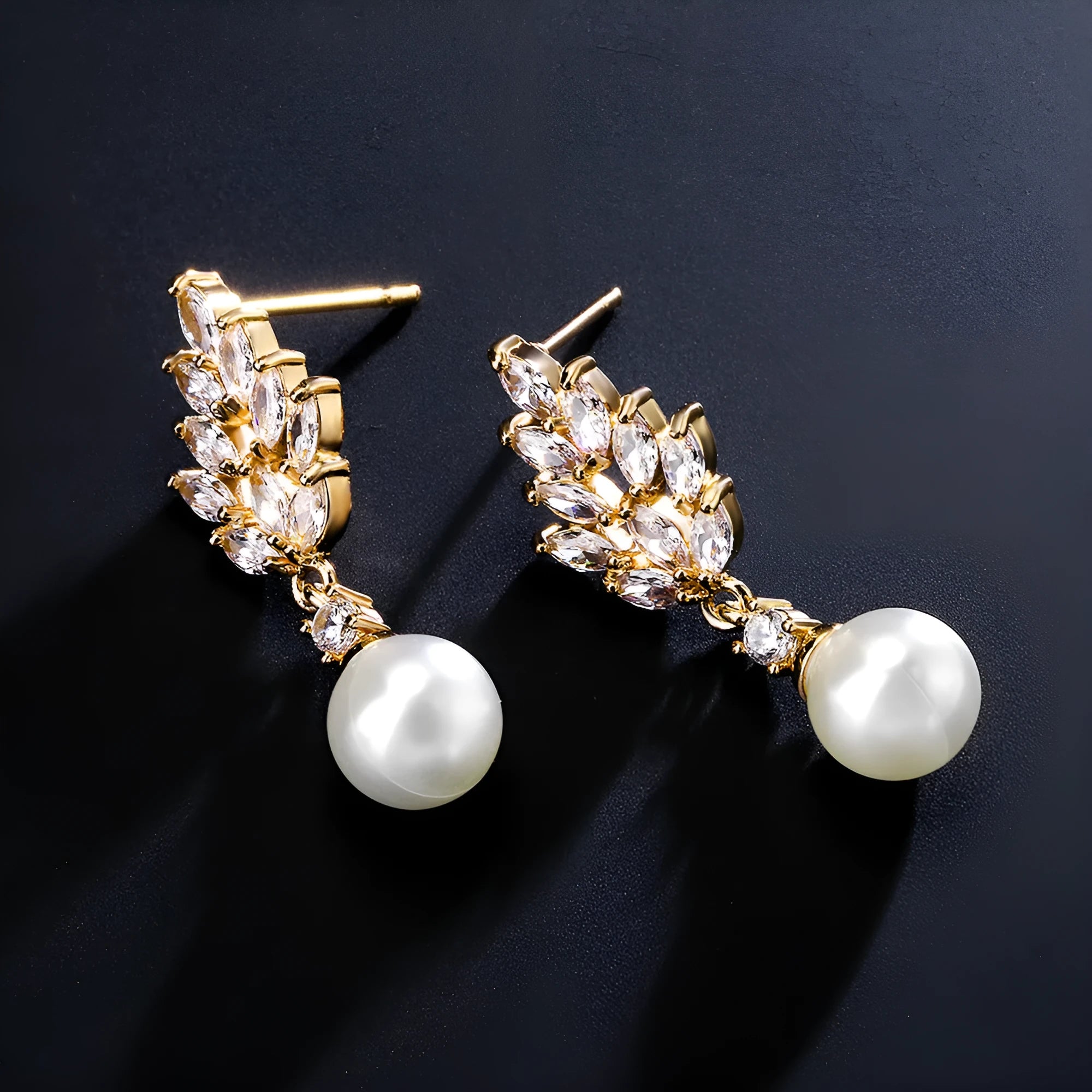 Geometric flower design pearl earrings with micro inlaid zircon stones in gold, platinum, or rose gold plated finishes.