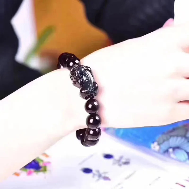 Natural ice colour eye obsidian crystal bracelet with banded patterns, shown in various bead sizes.