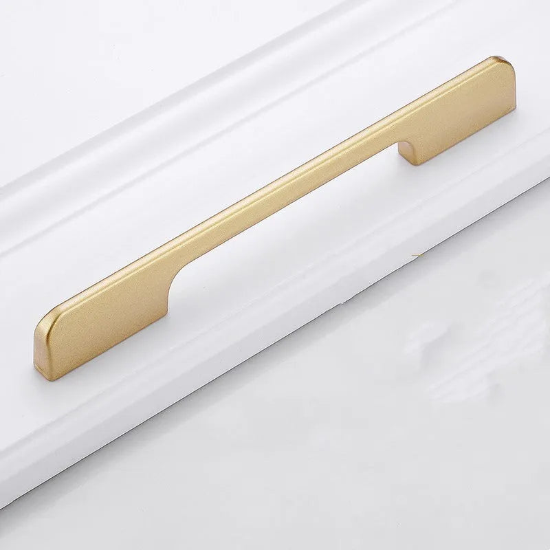Gold coloured aluminium alloy T-shaped cabinet door handle showing single hole mounting.