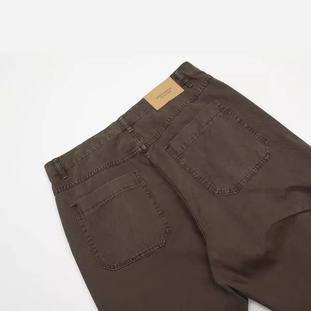 Men's brown straight-leg cotton trousers showing high-waist design and traditional straight-leg silhouette