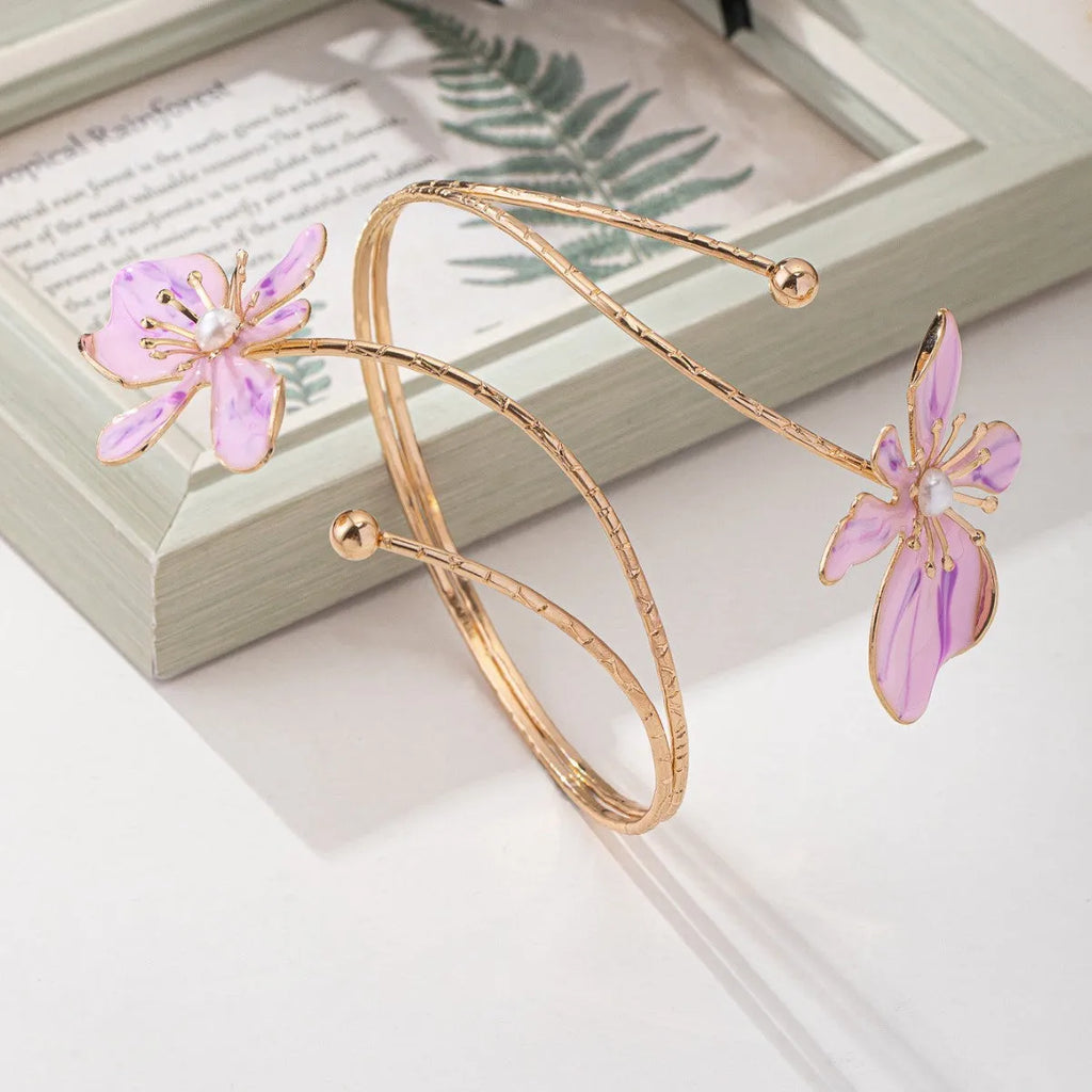 Alloy hollow armband bracelet with pattern lines shown in pink and purple colour options