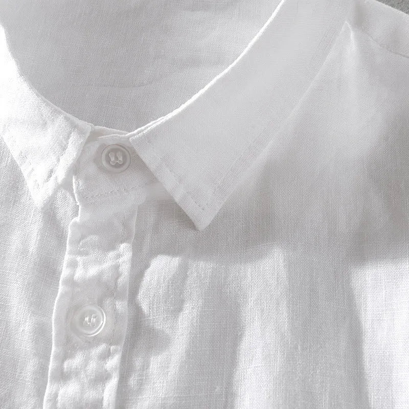Man wearing a loose fit apricot coloured short sleeve linen blend casual shirt.
