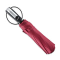 Black automatic open triple folding business umbrella with 10 ribs, shown in open position.