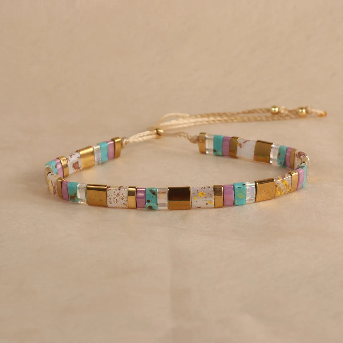 Geometric glass and coloured glaze beaded bracelet with round elements in five colour options