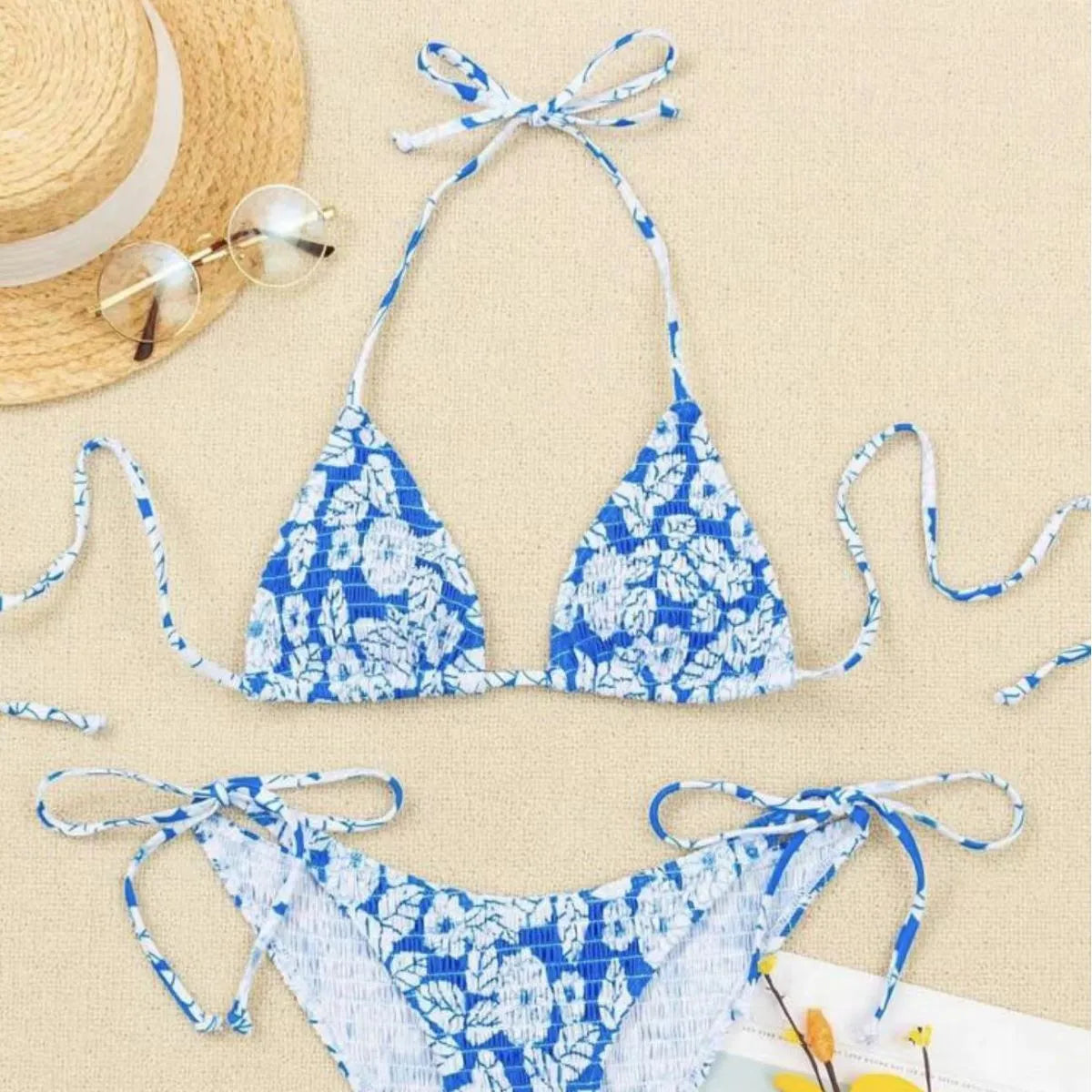 Women's floral print halter swimsuit bikini set in light blue on a mannequin