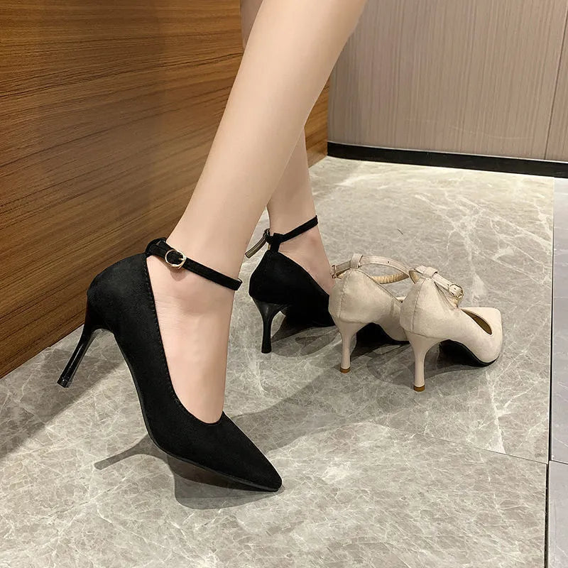 Women's black and creamy white stiletto heel pumps with buckle detail in 8cm and 5cm heel heights