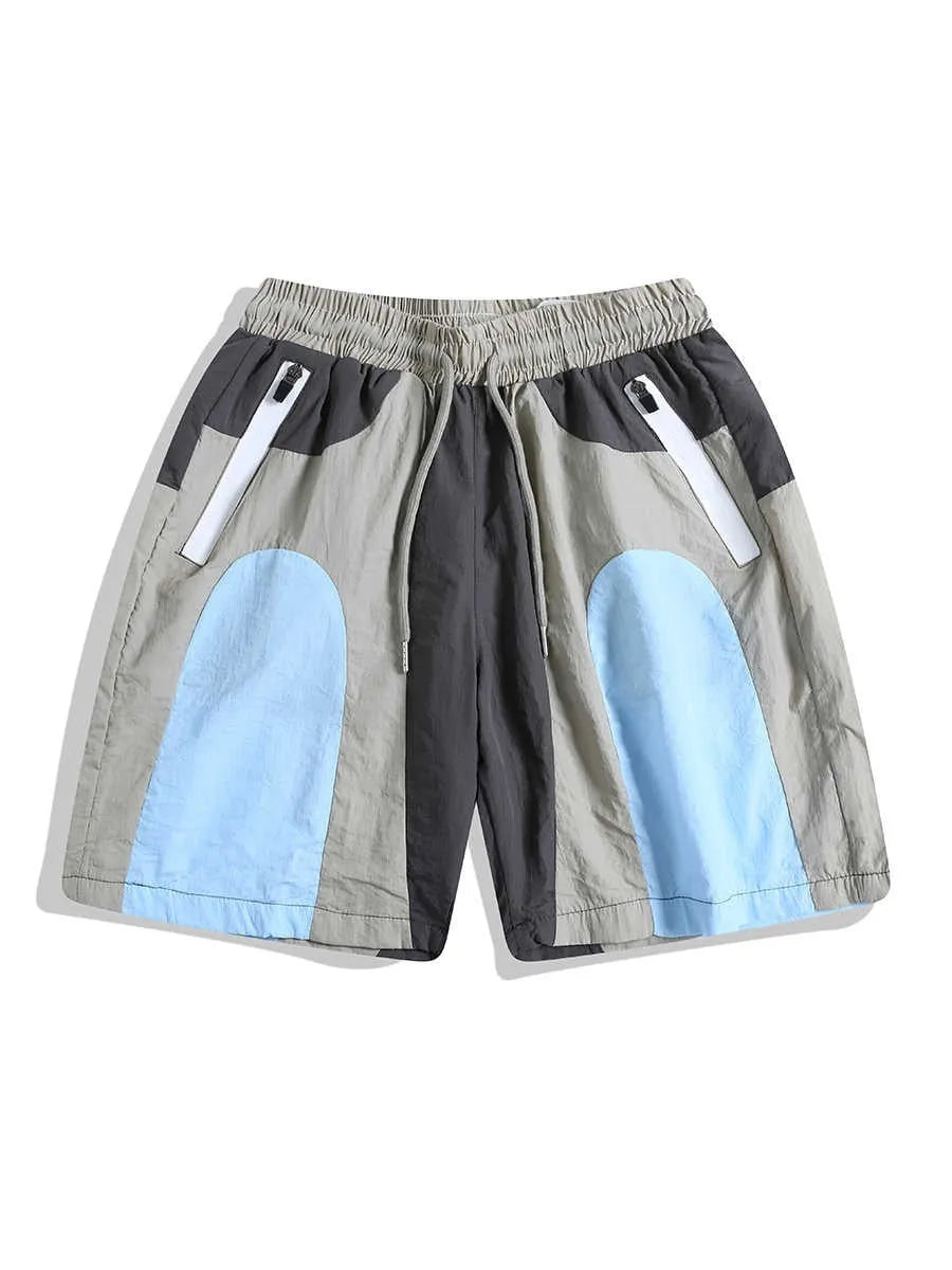 Blue patchwork men's sports shorts with elastic waistband and straight-leg design