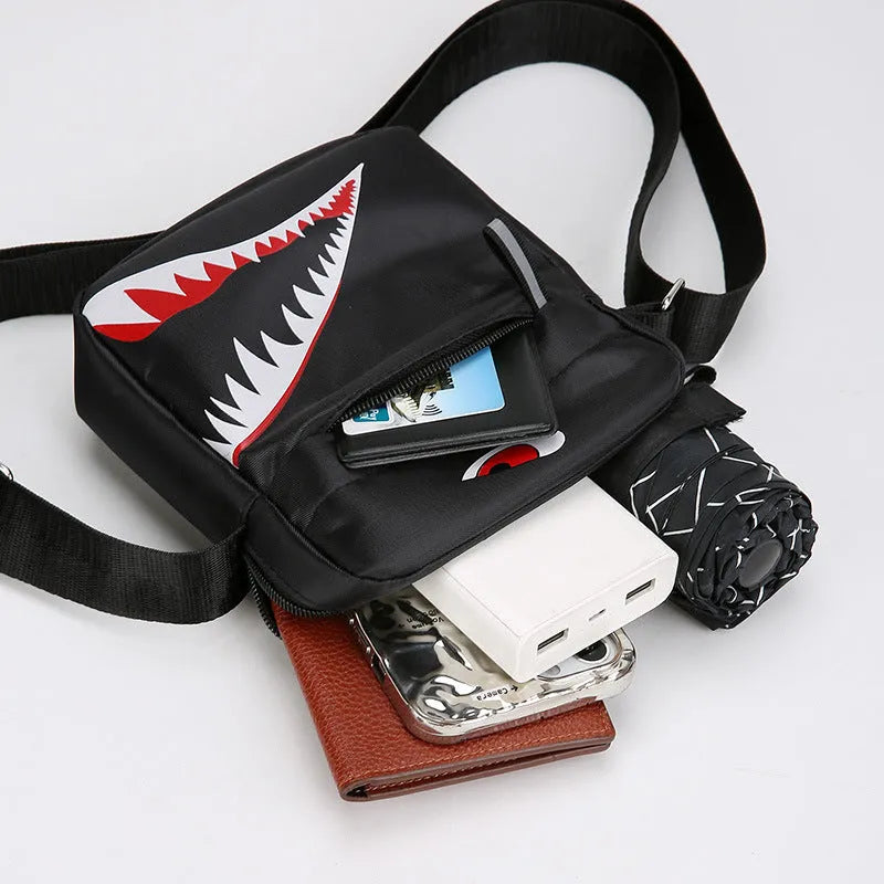 Men's black Oxford cloth crossbody bag with animal pattern design and shoulder strap
