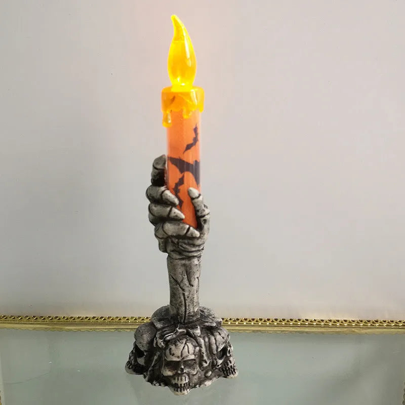 Plastic skeleton ghost holding a candle light Halloween decoration in orange and green